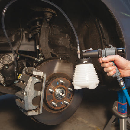 the 0349000 brake bleeder attached to the the vehicle so the brakes can be bled