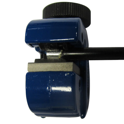 brake pipe coating removal tool shown with brake pipe in situ with coating removal.