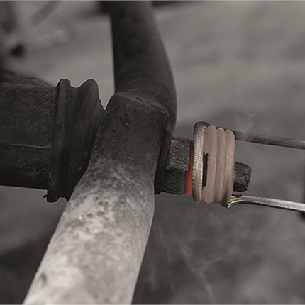 seized nut being heated with venom induction heater the coil shows the action of getting the nut red hot.